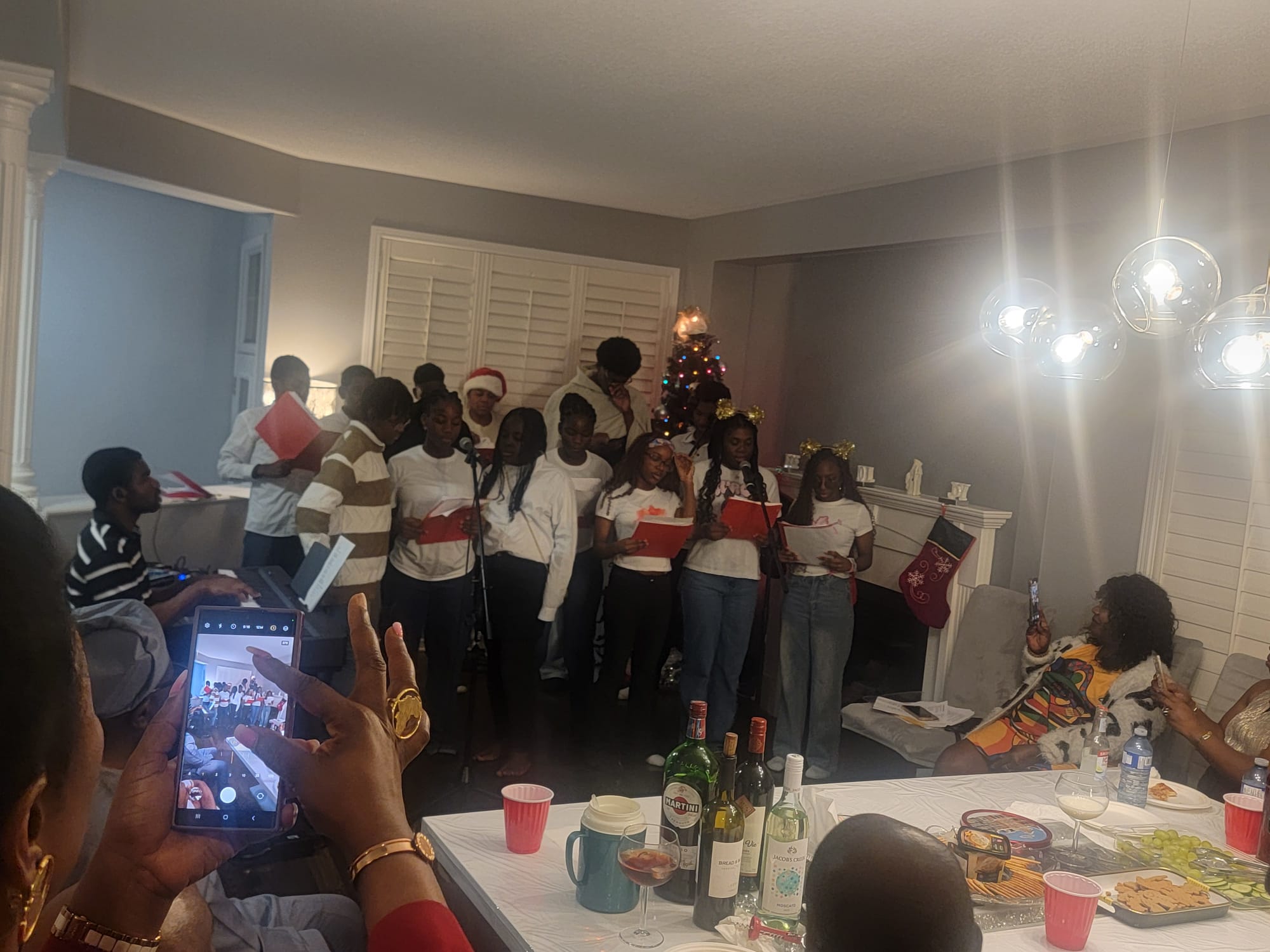 Youth group performing for the community during a holiday gathering
